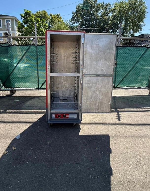 METRO C539-HDS-U full height insulated mobile heated cabinet, holds 17 pans, open door view, shows adjustable racks, 120v.