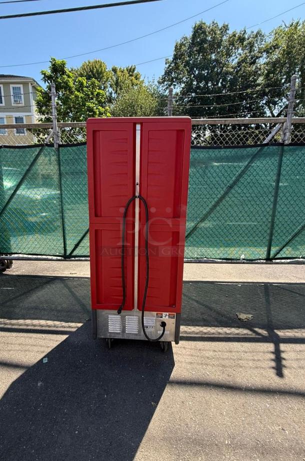 METRO C539-HDS-U full height mobile heated cabinet, red doors, 17 pan capacity, insulated, 120v, exterior visible, good condition.