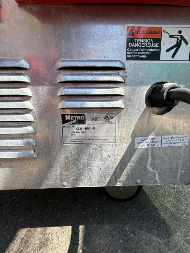 METRO C539-HDS-U insulated mobile heated cabinet, full height, 17 pan capacity, 120v, visible vent and warning label.
