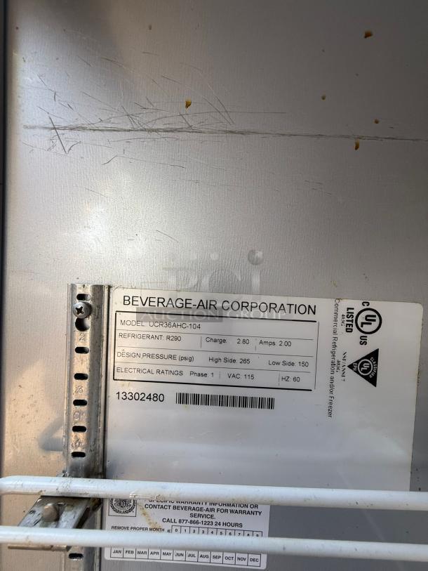 Beverage-Air UCR36AHC-23 refrigerator label showing model info, refrigerant type, and electrical ratings, some wear visible.