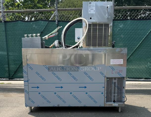 Perlick 4404 60" stainless steel beer dispenser refrigerator, holds five 1/4 kegs, visible labels, outdoor setting.
