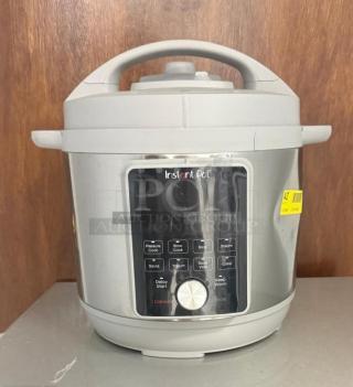 Instant Pot Pro Multi-Use Pressure Cooker in White, model lpzk0450032, excellent condition, with control panel and settings visible.