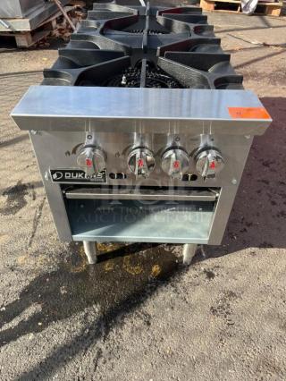 BRAND NEW Dukers DCSPA2 18" Cast Iron 3-Ring Burner Gas Stock Pot Range. Stainless steel finish, four control knobs.