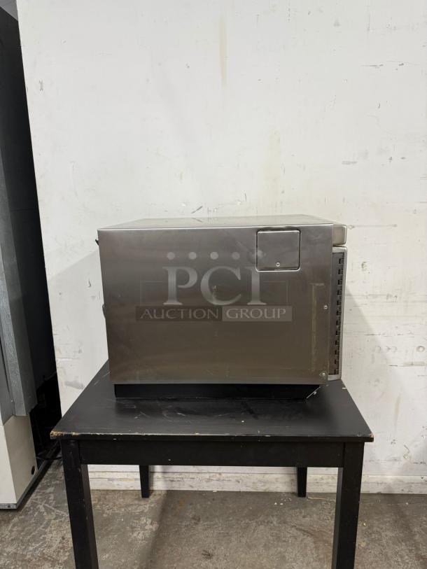 MENUMASTER RC17S2 commercial microwave, 19" heavy volume, 1700 watts, stainless steel, good condition, side view.