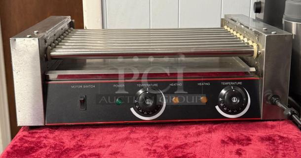 Hot Dog Roller Grill XCJ-9CZ-US, slanted top, manual controls, 120v, dual temperature dials, used condition.