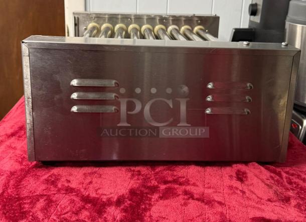 Hot Dog Roller Grill XCJ-9CZ-US, slanted top, stainless steel, manual controls, 120v, clean condition, visible vent details.