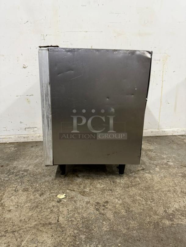 Silver King SKTTR7 undercounter refrigerator, visible scratches and dents, stainless steel exterior, model tag included.