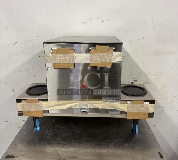 Bunn Axiom 0/6 Twin 12 Cup Coffee Brewer with 6 lower warmers, stainless steel, taped packaging, PCI Auction Group logo.