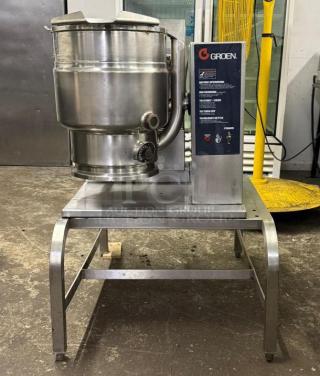 GROEN TDH/20 gas steam jacketed tilting kettle, stainless steel, visible controls, sturdy stand, label shows model and make.