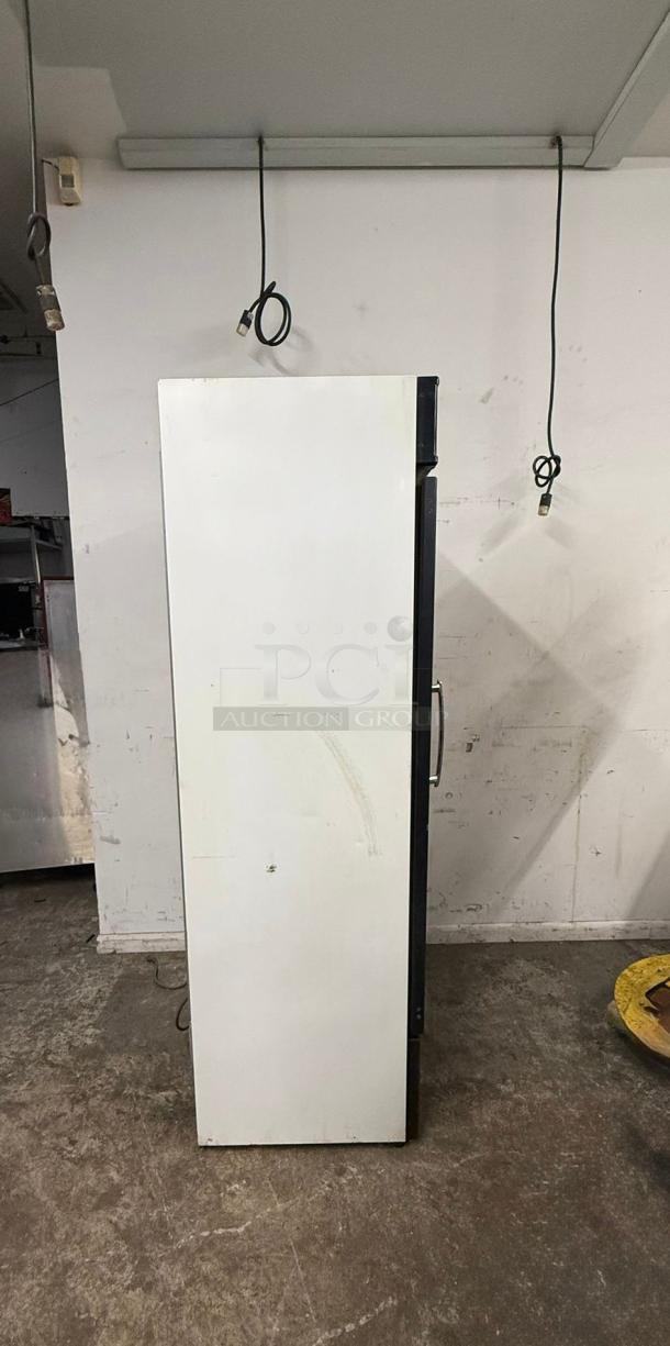 Master-Bilt Coca-Cola cooler merchandiser, model with one glass door, white exterior, visible side handle, commercial use.