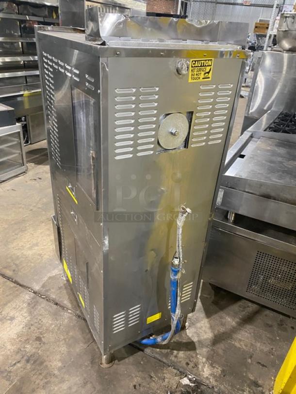 Cleveland Range SteamCraft Power-10 stainless steel dual compartment convection steamer, model 24CGP10, on legs, with individual controls and built-in pan holding racks. Natural gas powered, 115V 1 Phase, with visible caution labeling.