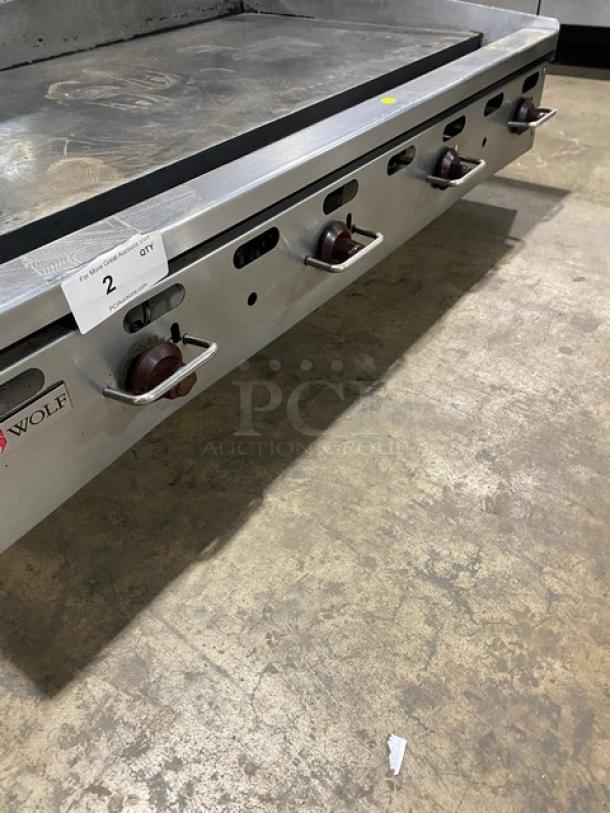 Wolf commercial stainless steel natural gas countertop griddle with back and side splash, on legs, working condition.
