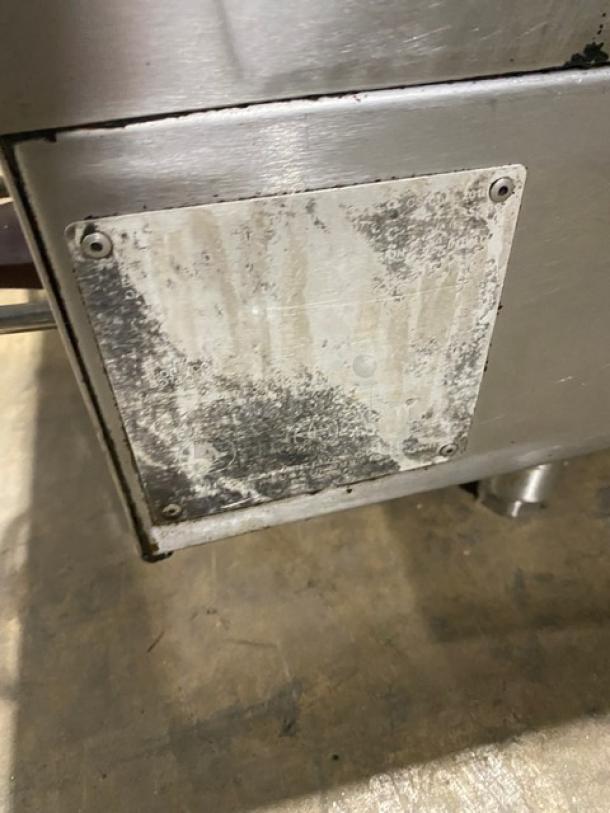 Wolf commercial stainless steel natural gas countertop flat griddle, with back and side splash, on legs, worn label.
