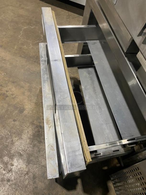 Commercial stainless steel 2-drawer refrigerated low boy/chef base on casters, open drawers, good condition.