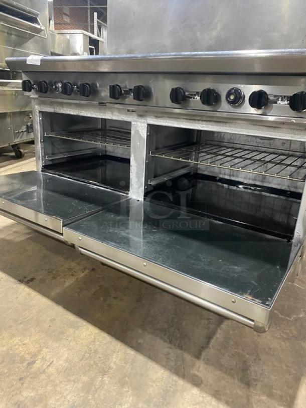American Range commercial stainless steel 10-burner range with double ovens, wired racks, backsplash, on casters.