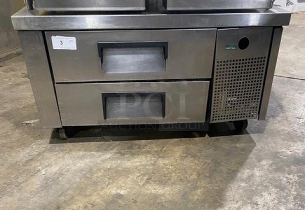 Commercial stainless steel 2-drawer refrigerated low boy chef base on casters, featuring a durable design and ventilation panel.
