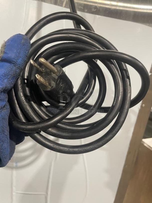 Coiled black power cord with a three-prong plug, part of the Alto-Shaam Halo Heat Series equipment.