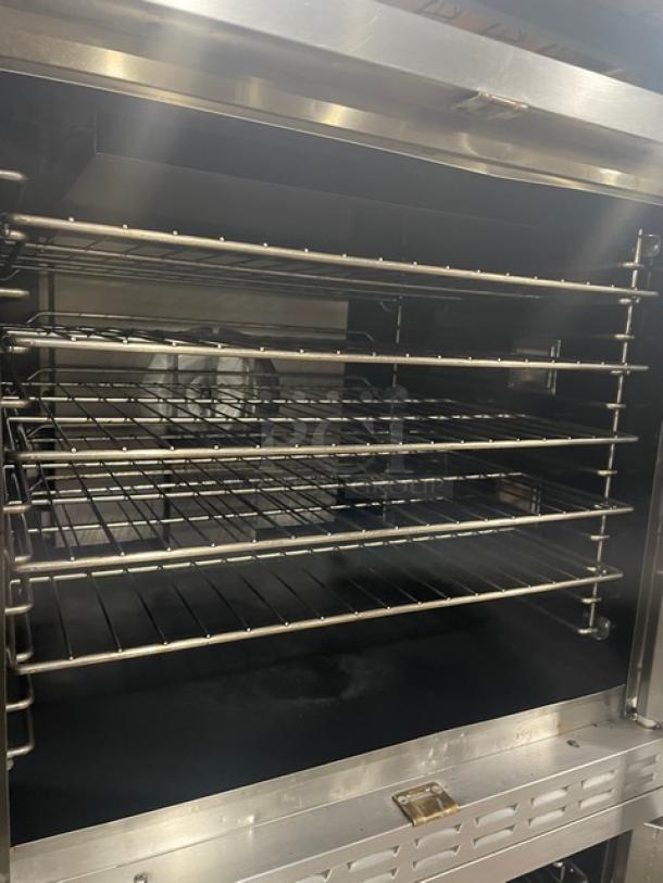 Alto-Shaam ASC4G 2019 convection oven, stainless steel, natural gas, wired racks, thermostatic controls, on casters.