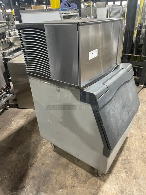 Manitowoc SD0303W ice machine, electric, stainless steel, water-cooled, lift-style door, 115V, on legs, commercial use.