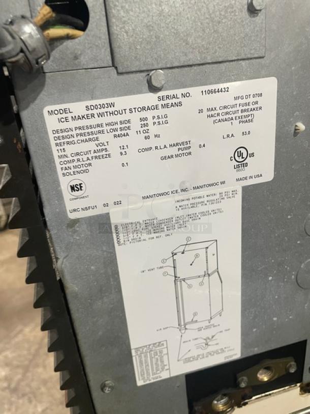 Manitowoc SD0303W stainless steel electric ice maker, water-cooled, model SD0303W, serial 110664432, 115V, with lift-style bin door.