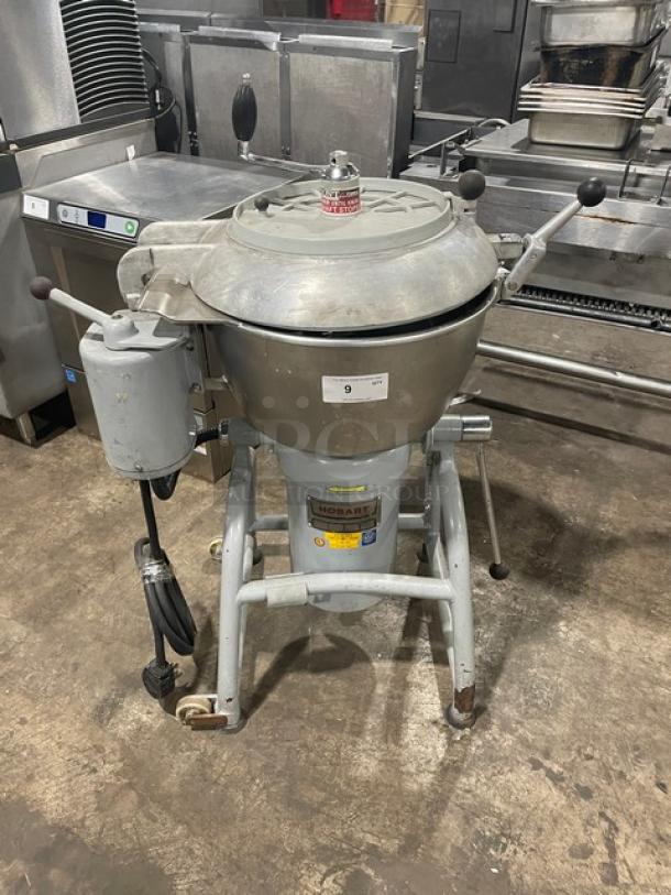 Hobart commercial electric chopper/mixer with stainless steel tilting bowl and cover, on legs with casters. Good condition.