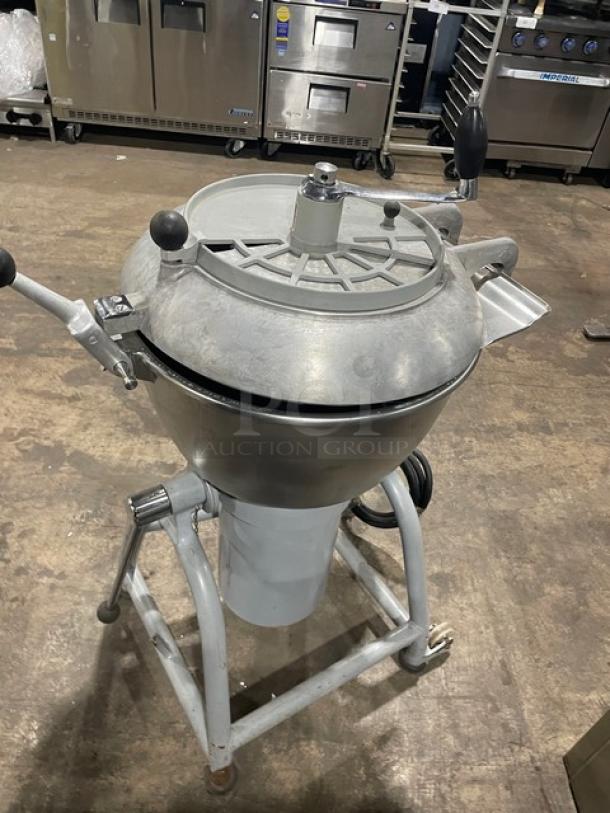 Hobart commercial electric chopper/mixer with stainless steel tilting bowl and cover, on legs and casters; good condition.