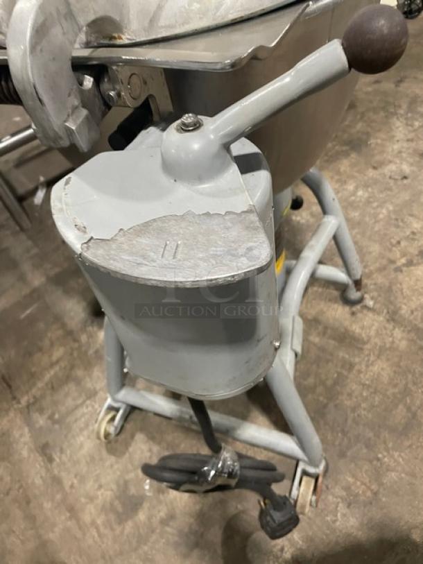 Hobart commercial heavy-duty chopper/cutter/mixer with stainless steel tilting bowl, cover, and casters. Used condition.