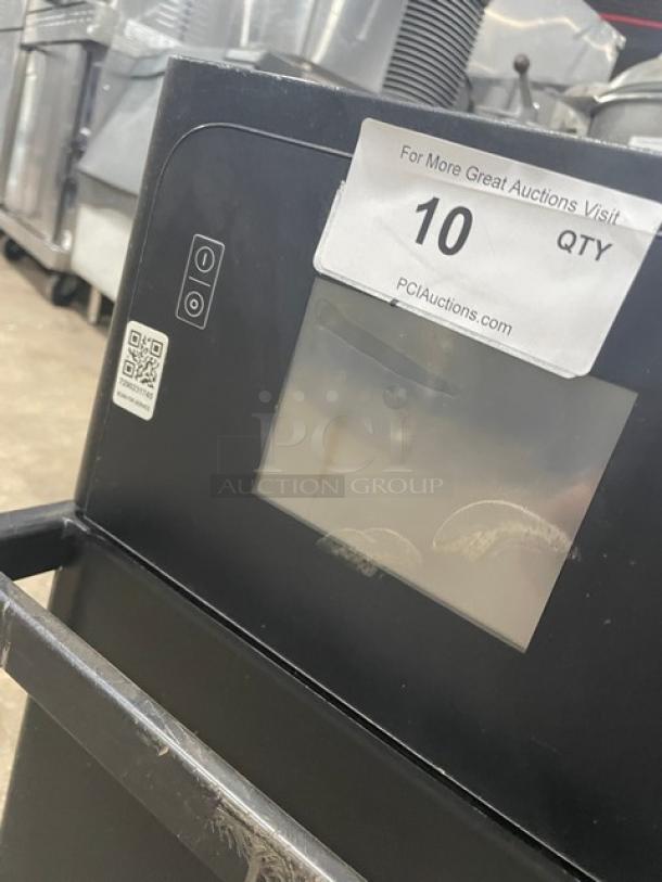 MerryChef Eikon E2S rapid cook oven, black, electric, countertop, 208/240V 1 phase. Auction tag visible. Late model.