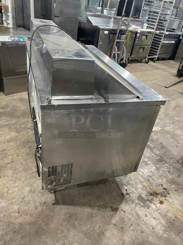 Randell stainless steel 2-door refrigerated prep table, model 9040K7, on casters, with poly-coated wire rack, 115V.