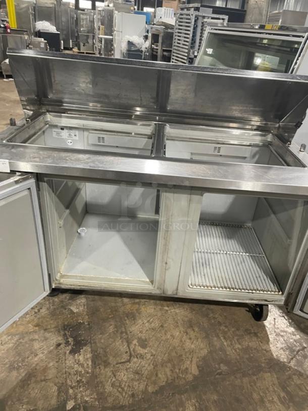 Randell stainless steel 2-door refrigerated prep table, Model 9040K-7, with poly-coated wire rack, casters, 115V, used condition.