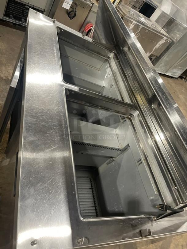 Randell 9040K7 stainless steel 2-door refrigerated prep table, bain-marie style, with poly-coated wire rack, on casters.