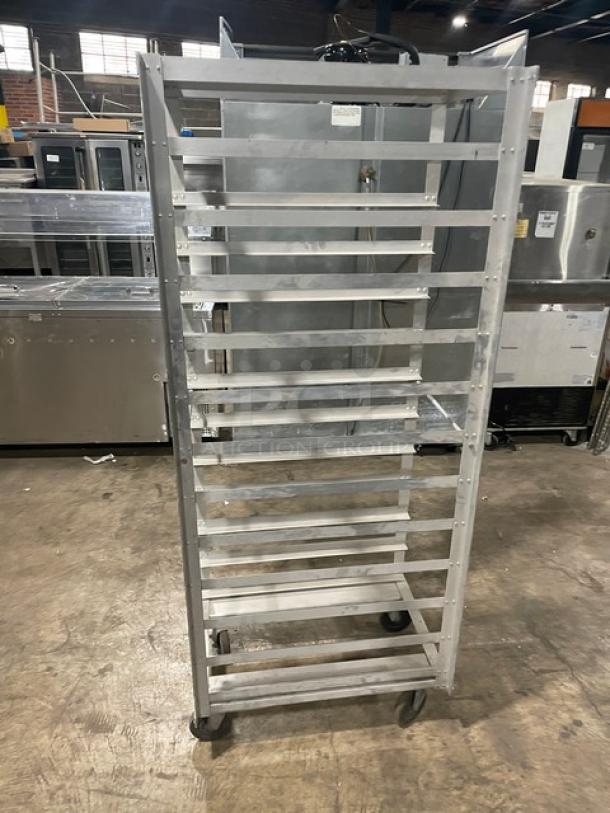 Commercial heavy-duty pan holding/transport rack on casters, metal, 10-tier, used, industrial setting.
