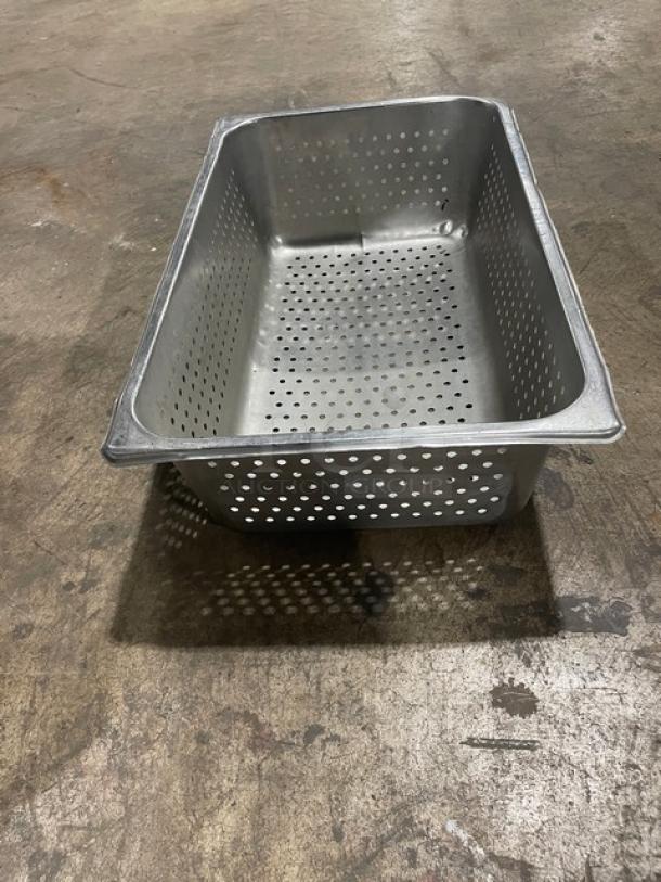 Commercial stainless steel full-size perforated steamtable pan in excellent condition on display. Ideal for catering.