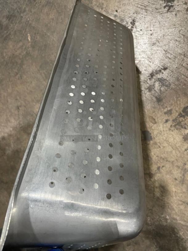 Commercial stainless steel perforated steamtable pan, full-size. Durable, with visible perforations for efficient steaming.