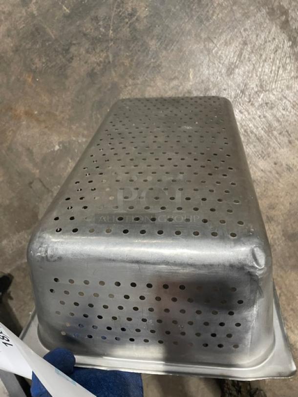Commercial stainless steel perforated hotel pan, full-size, showing top view and perforations. Used condition, suitable for steam table use.