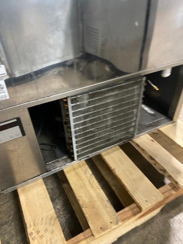 RPI Industries VIAS434RSQSC stainless steel refrigerated display case, rear view. Includes ventilation kit, good condition.