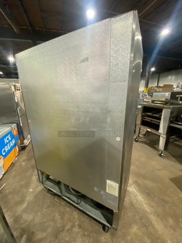 Kelvinator KCBM48R stainless steel 2-door commercial refrigerator, poly-coated wire racks, on casters, 115V, in used condition.