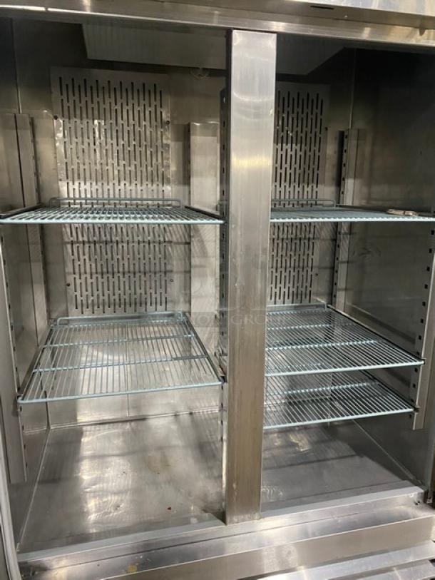 Kelvinator KCBM48R commercial stainless steel 2-door fridge, poly-coated wire racks, on casters, model SN 1B33501587.