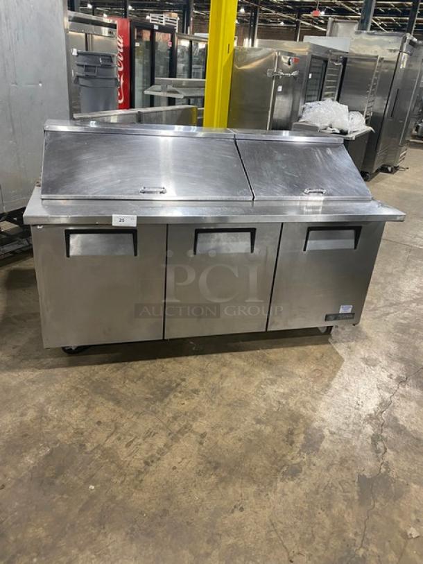 True Commercial Stainless Steel 3-Door Refrigerated Bain Marie Prep Table, Model TSSU-72-30M-B-ST, on casters, with poly-coated wire racks.