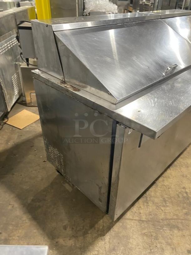 True TSSU-72-30M-B-ST stainless steel 3-door refrigerated prep table, bain marie style, on casters, with poly-coated wire racks.