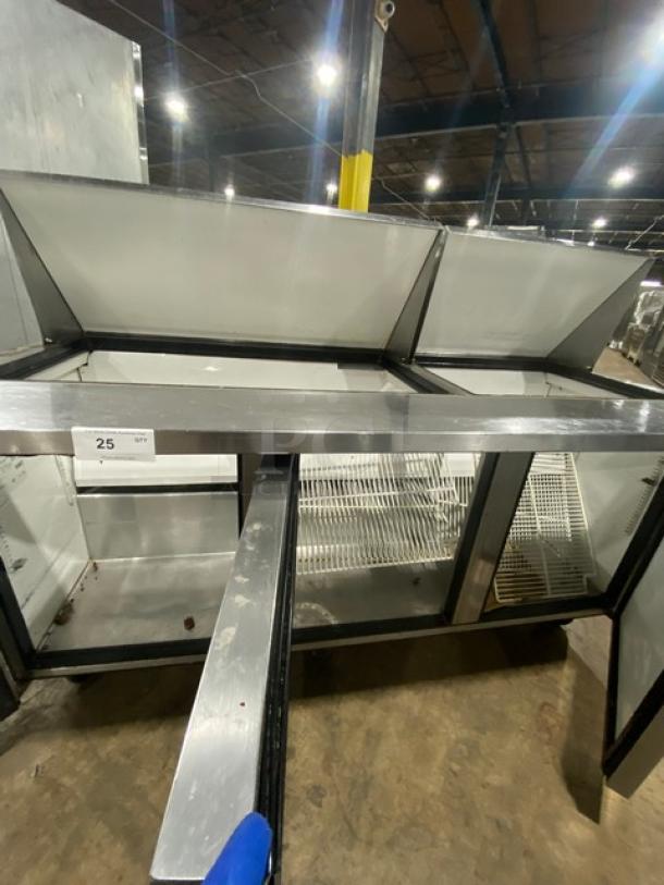 True TSSU-72-30M-B-ST 3-door stainless steel refrigerated prep table with poly-coated wire racks on casters, 115V.