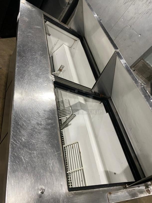 True TSSU-72-30M-B-ST 3-door prep table. Stainless steel, poly coated racks, bain marie style, on casters, 115V.