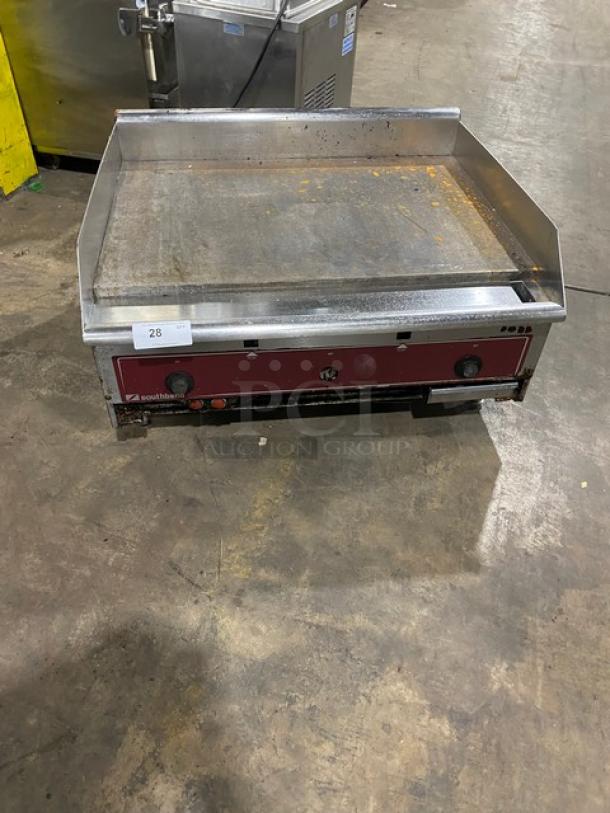 Southbend commercial stainless steel natural gas countertop flat griddle with back and side splash, on legs, used condition.