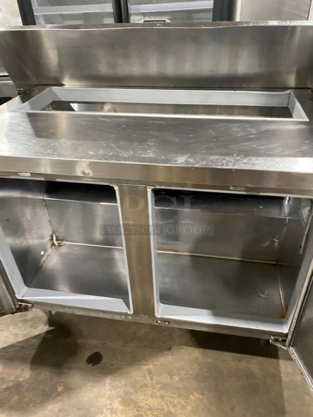 Continental stainless steel 2-door refrigerated Bain Marie style salad/sandwich prep table, on legs, 115V, shows wear.