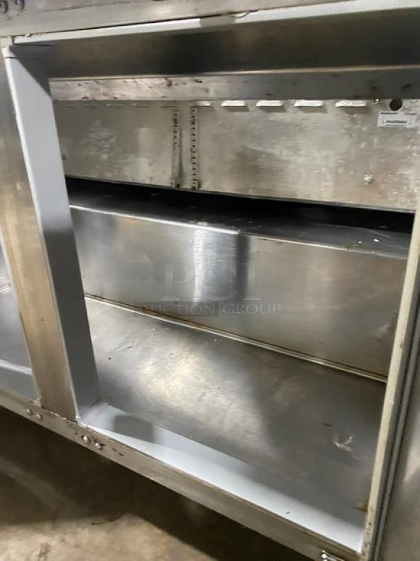 Continental 2 Door Stainless Steel Refrigerated Prep Table, Bain Marie Style, 115V, on Legs. Visible wear, no tags.