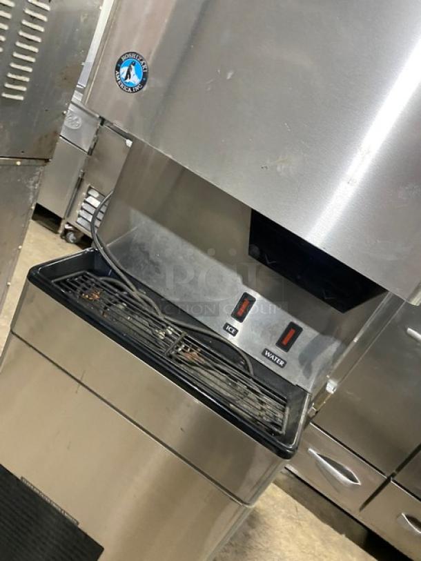Hoshizaki stainless steel ice and water dispensing machine, model DT-400BAH-OS, commercial grade, electric, on legs.