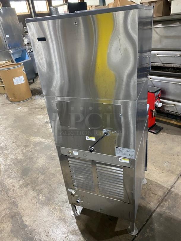 Follett Symphony Plus 110FB425W ice and water dispenser, stainless steel, water-cooled, electric-powered, on legs, good condition.