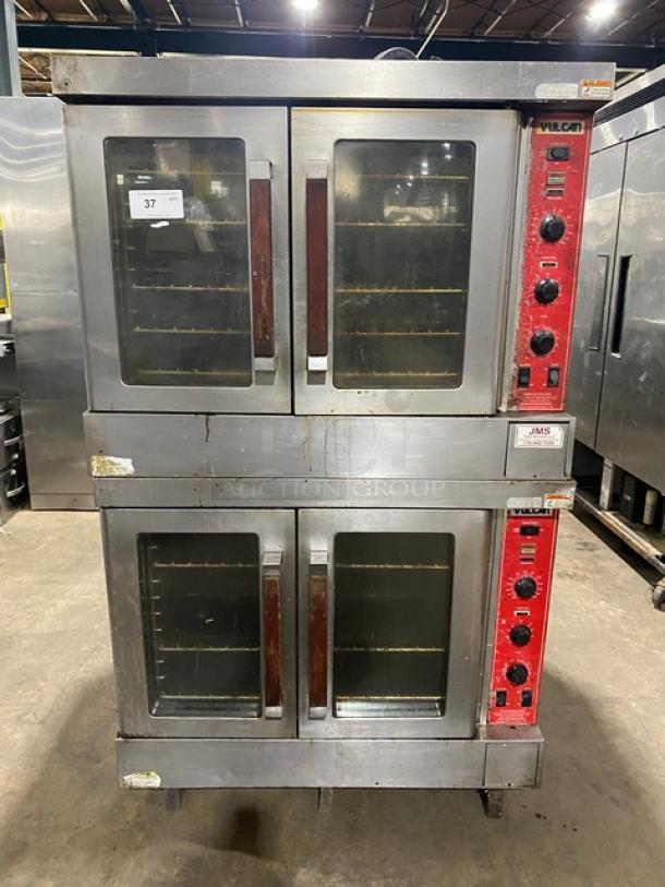 Vulcan stainless steel double-stacked convection oven, natural gas, thermostatic controls, wired racks, on casters.