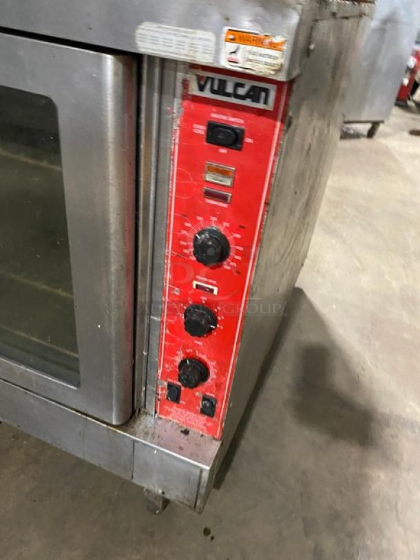 Vulcan stainless steel double-stacked convection oven with thermostatic controls, wired racks, and casters; natural gas powered.