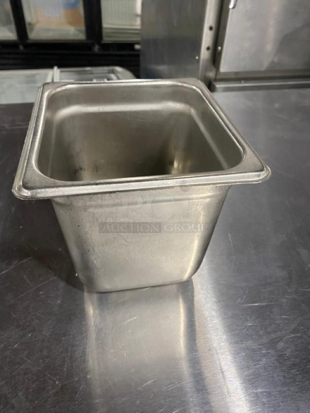 Commercial stainless steel steamtable pan, used condition, rectangular shape, smooth edges, suitable for hotel kitchen use.